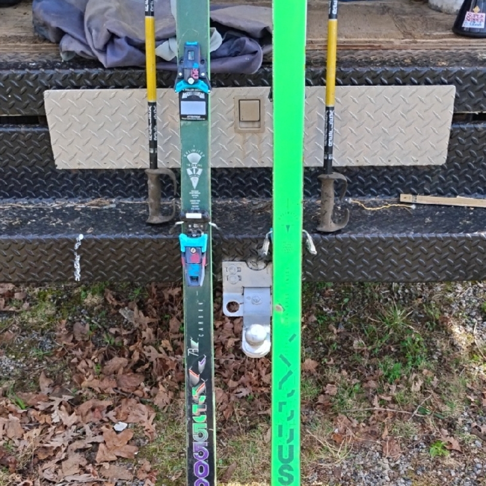 Green and Black Skis with Bindings